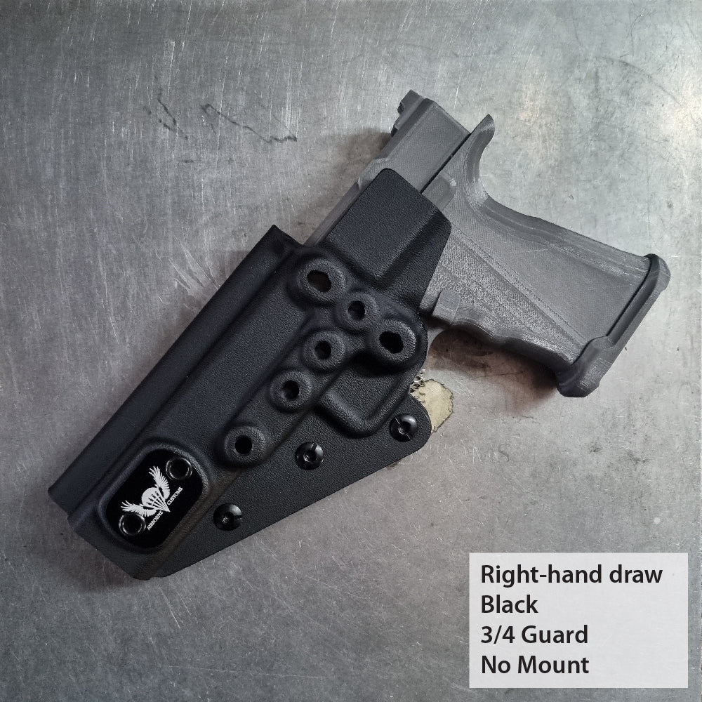 Black gun holster with 3/4 guard on a metallic surface